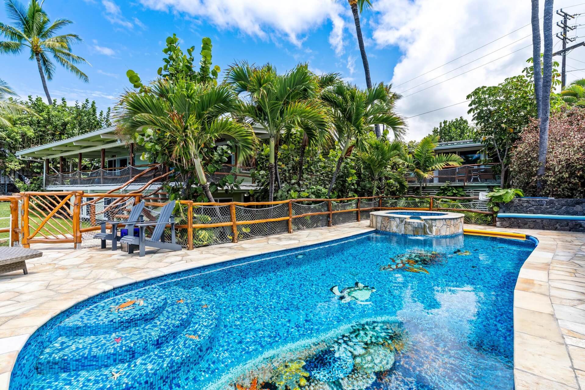 The pool and backyard of a rental in Hawaii.